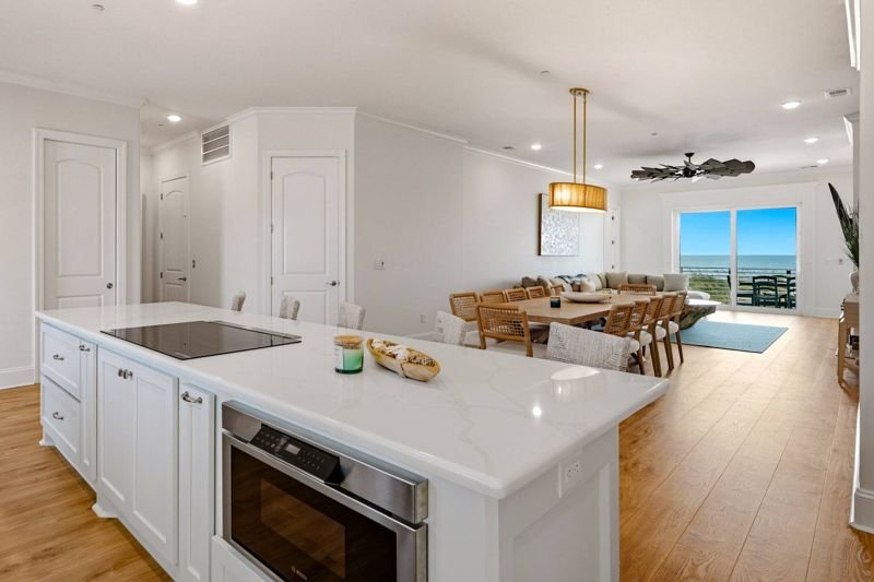 The cooktop island and ocean-view dining