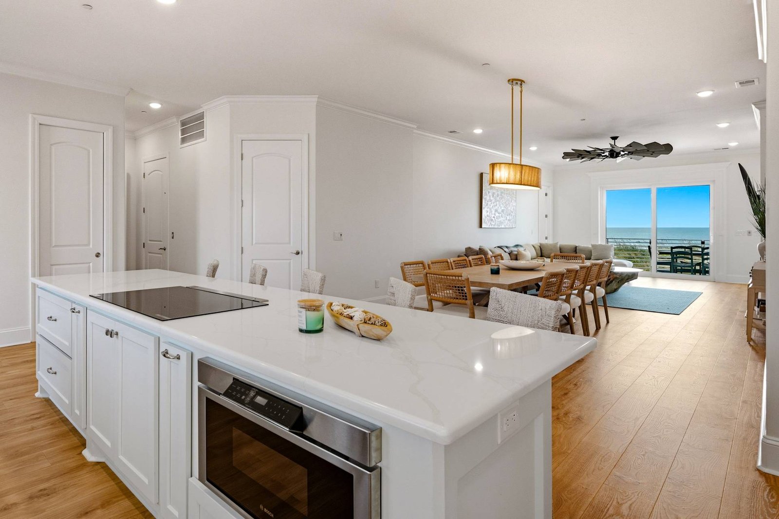 The cooktop island and ocean-view dining